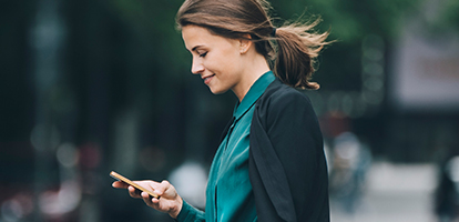 image of a woman making a same day appointment on her phone