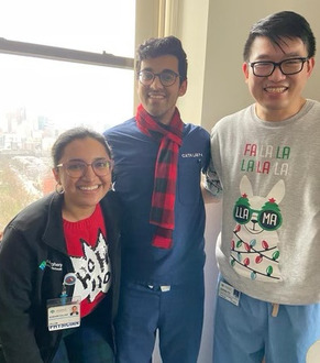 AHN Cardiovascular Disease fellows dressed in Christmas inspired sweaters and scarfs.