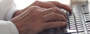 closeup of a set of hands working on a tablet device