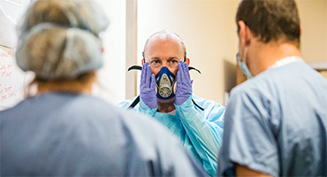 A nurse demonstrating proper PPE guidelines.