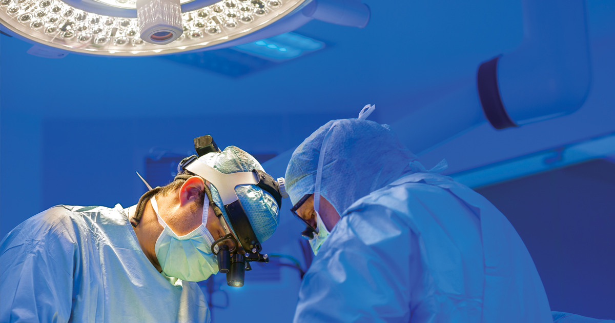 Surgeons at operating table