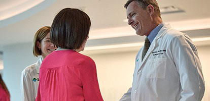 Two AHN cancer specialist talking to a patient.