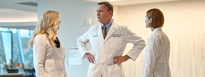 Three AHN cancer specialists talking.