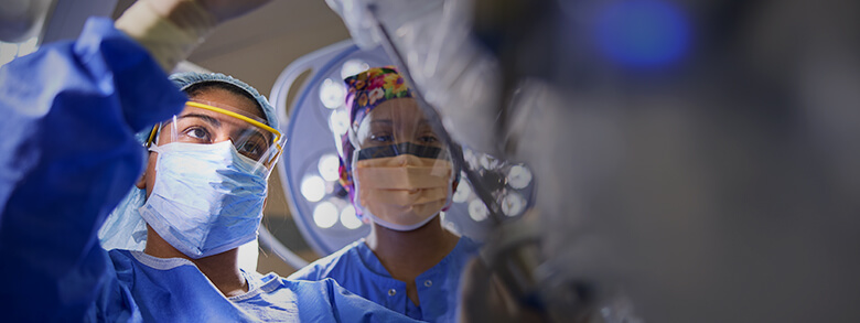 Group of surgeons at operating table