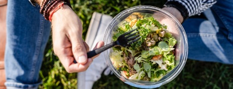 image of a person eating a salad