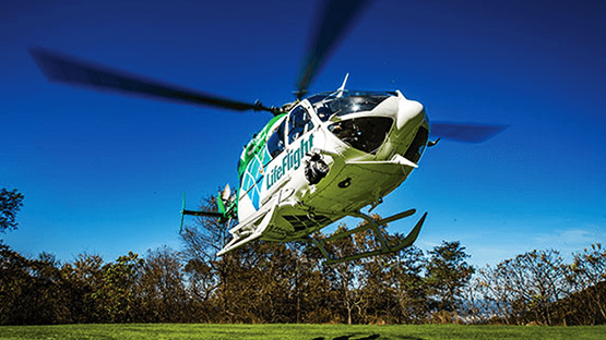 An AHN LifeFlight helicopter parked on a helicopter platform.