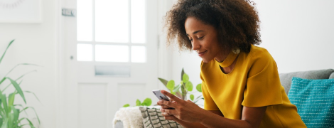 A woman using a mobile phone.