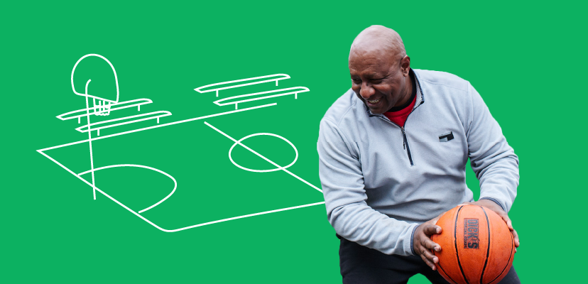 A man holding a basketball on a green background with an illustration of a basketball court and a brick wall with a heart in it.