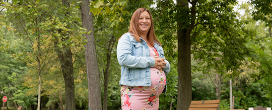 Grove City Hospital patient Kayla Gregorish smiling at the camera outdoors.