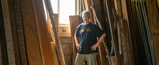 West Penn Hospital cancer survivor Gene Mazzetti in his woodshop.